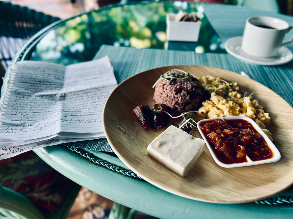 Handwritten notes lie next to a plate of gallo pinto in Nicaragua.